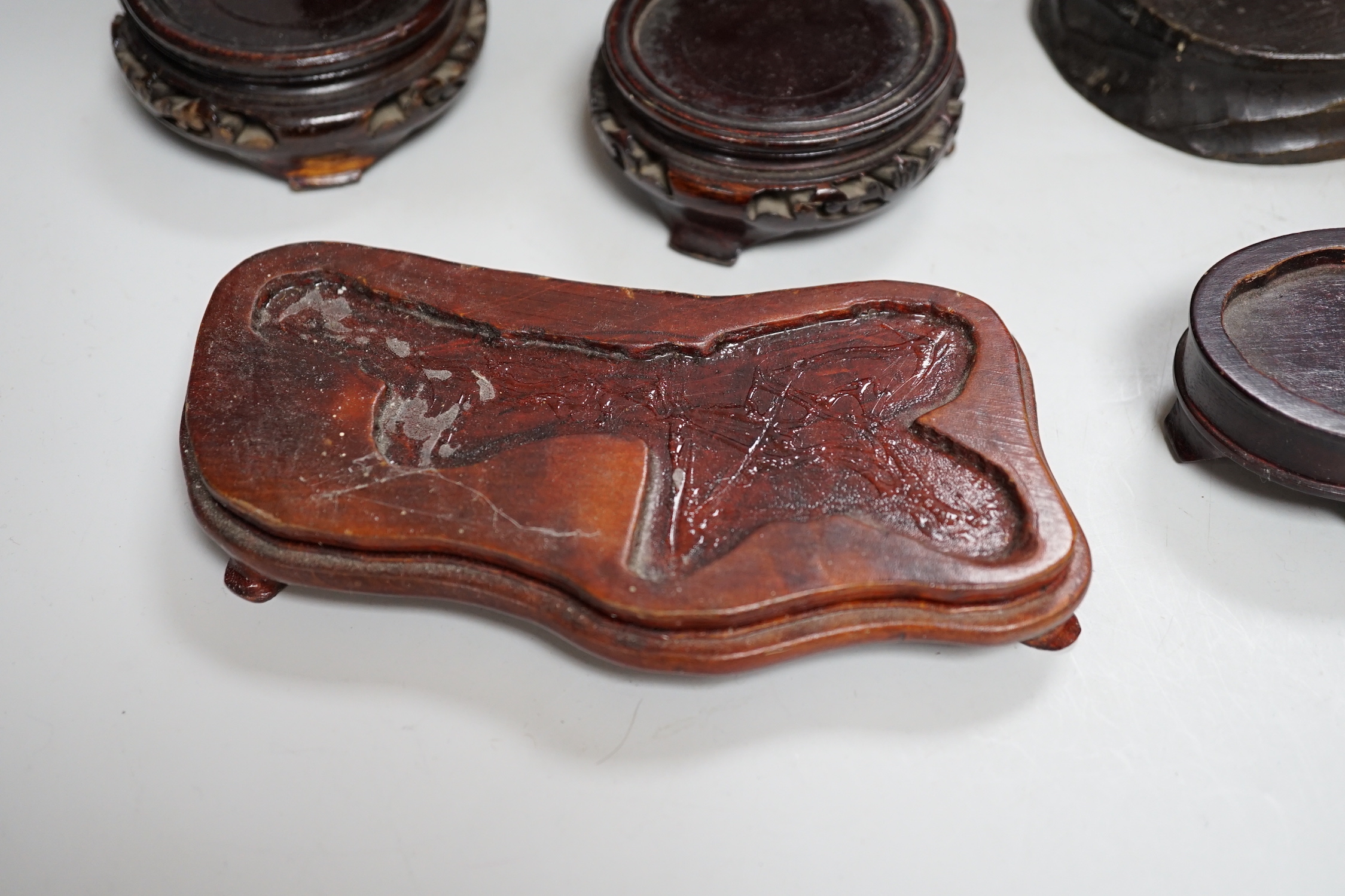 A group of Chinese wood stands and a perfume holder